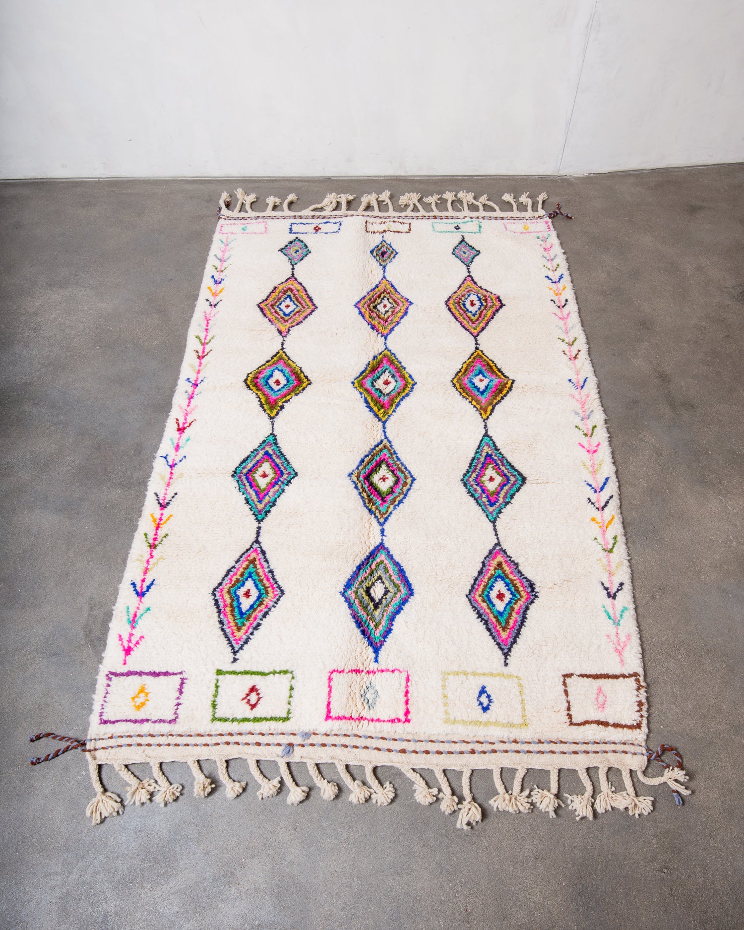 Modern, designer, handcrafted Berber rug from Morocco. Beniourain carpet with beautiful colours and patterns and fluffy wool texture.